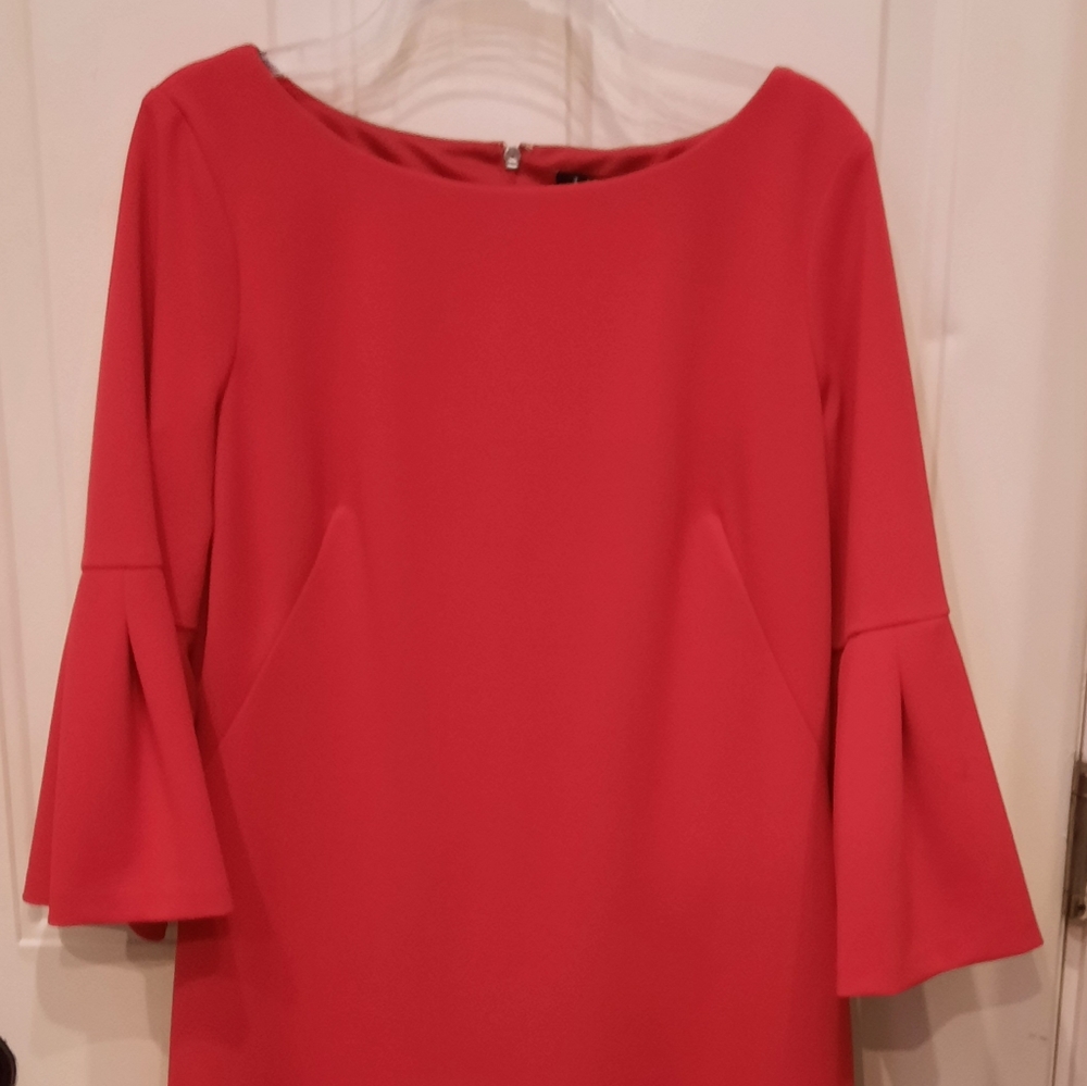 Red,knee length, dress with bell 3/4 sleeves.